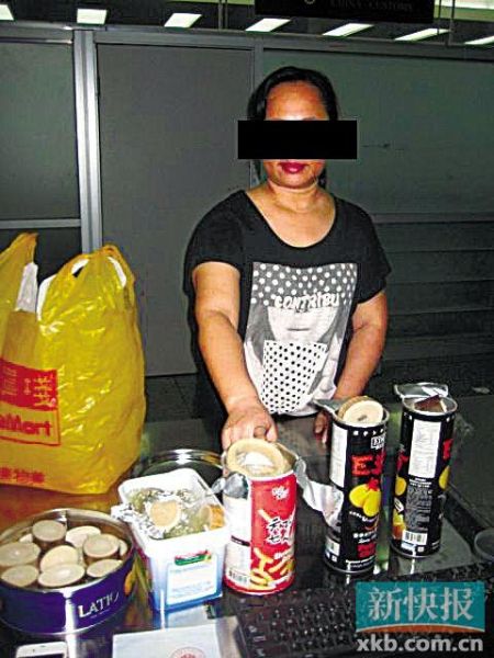 女子收300港元帮人带11斤象牙入境 藏零食罐